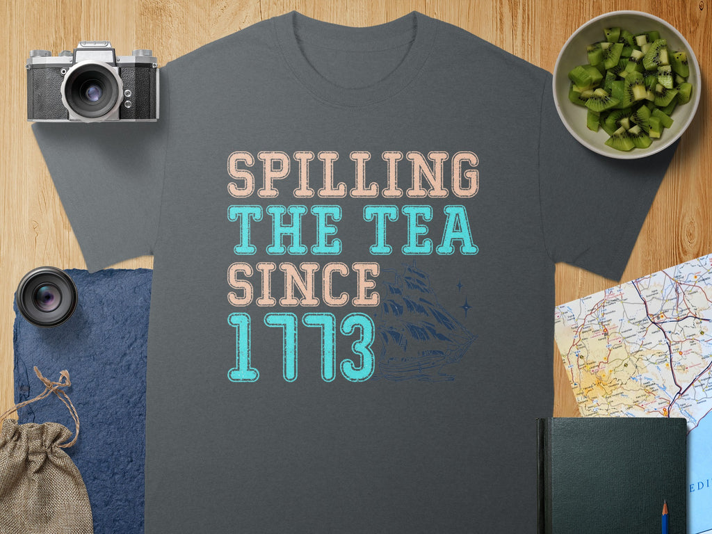 T-shirt with "Spilling the Tea Since 1773" text and sailing ship graphic.