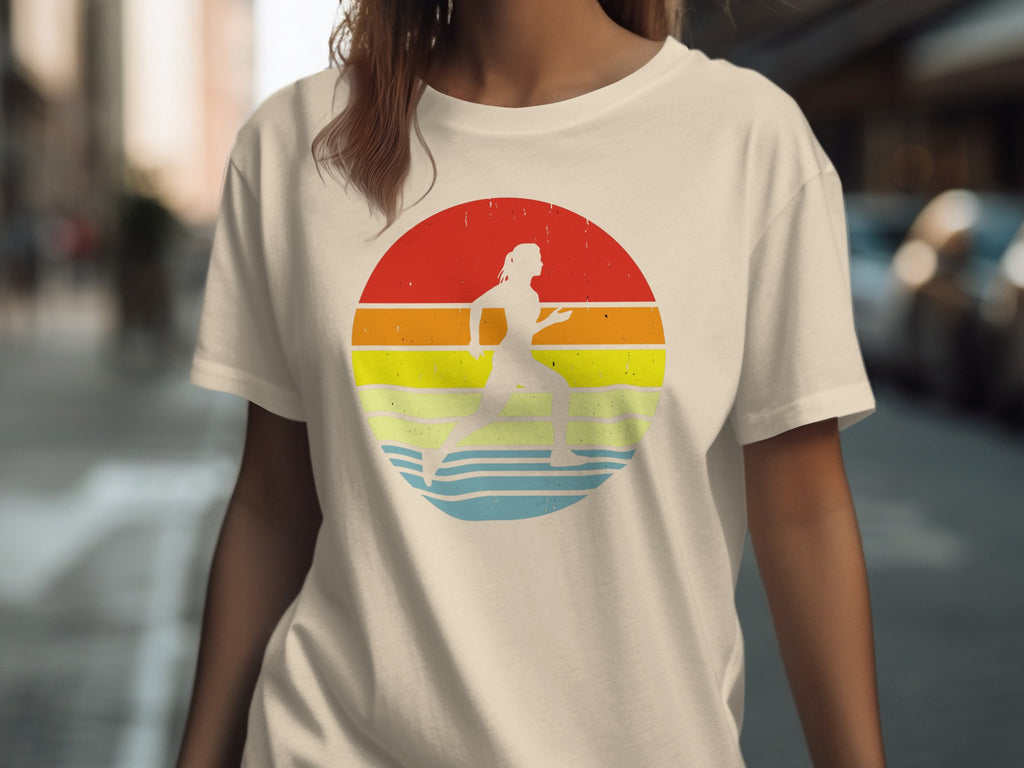 Cream t-shirt with a runner silhouette within a vintage sunset circle graphic.
