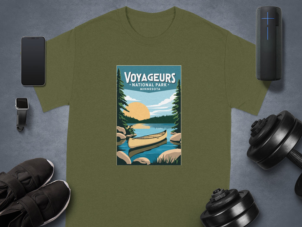 Olive green t-shirt featuring "Voyageurs National Park Minnesota" graphic with canoe.