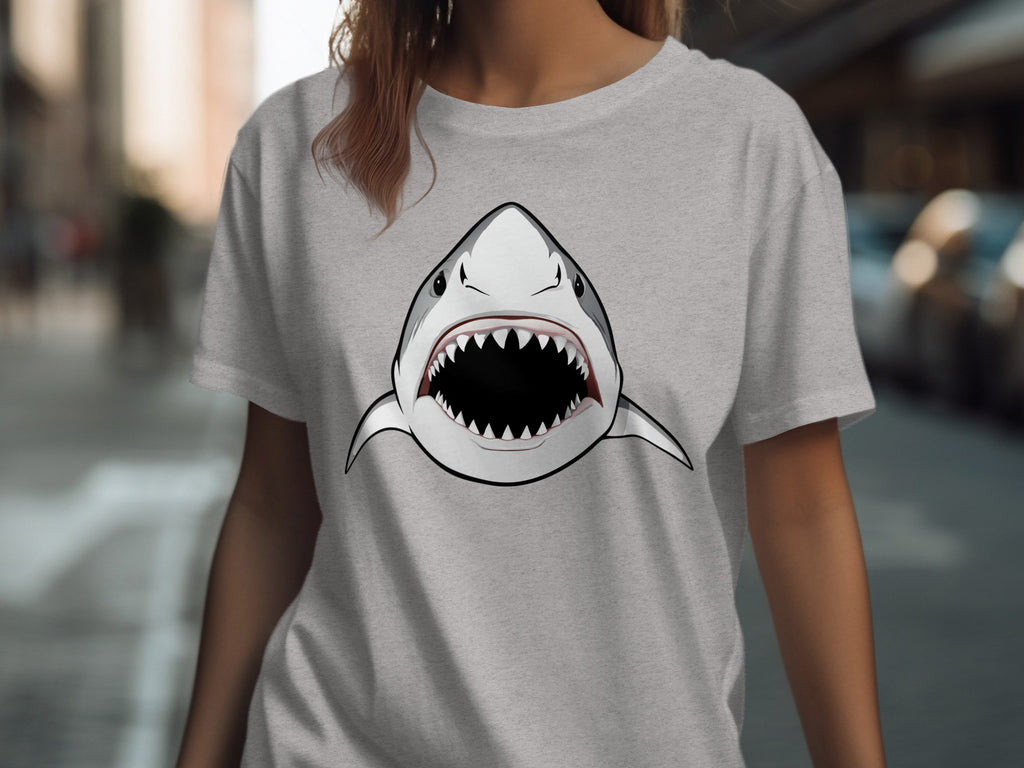 Grey t-shirt with a cartoon shark head graphic with mouth open wide.
