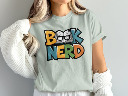Light green t-shirt with colorful "BOOK NERD" text and an open book with glasses.