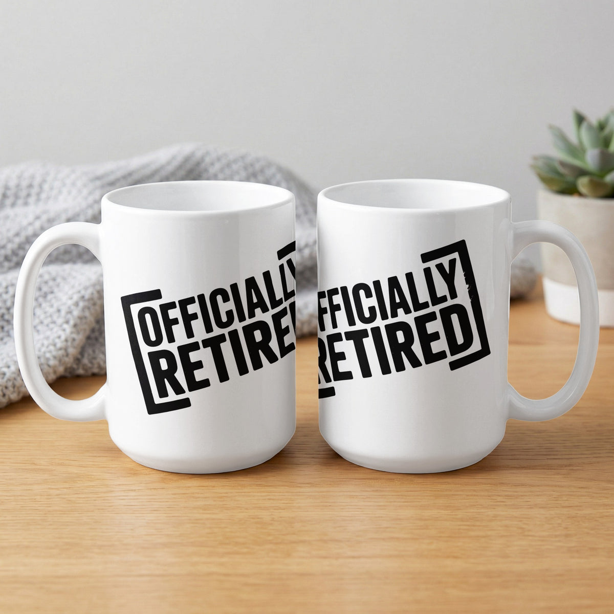 Two white mugs with "OFFICIALLY RETIRED" text in black block letters.
