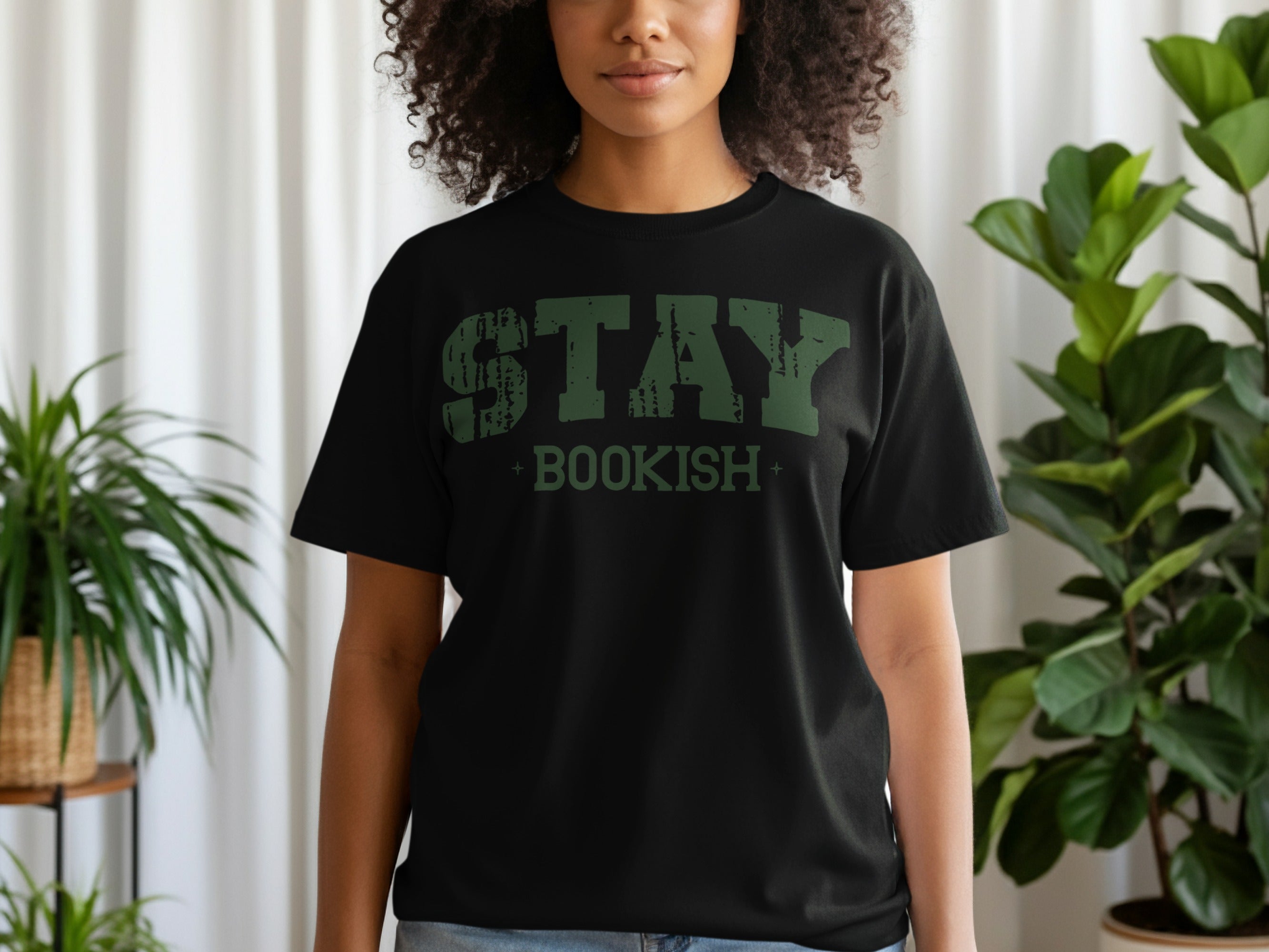 Black t-shirt with distressed green text reading "STAY BOOKISH".