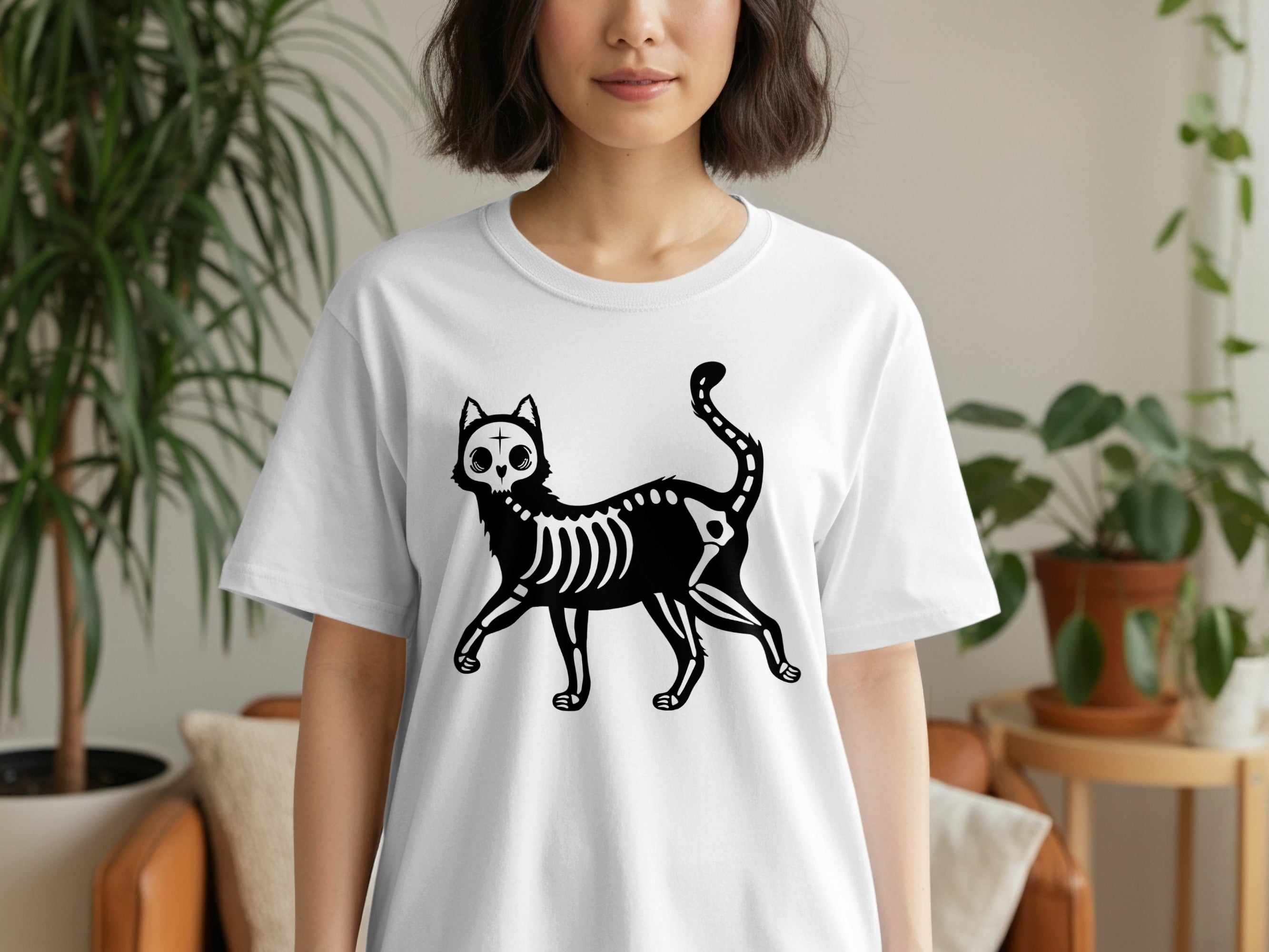 White t-shirt with a black skeleton cat graphic on the front.