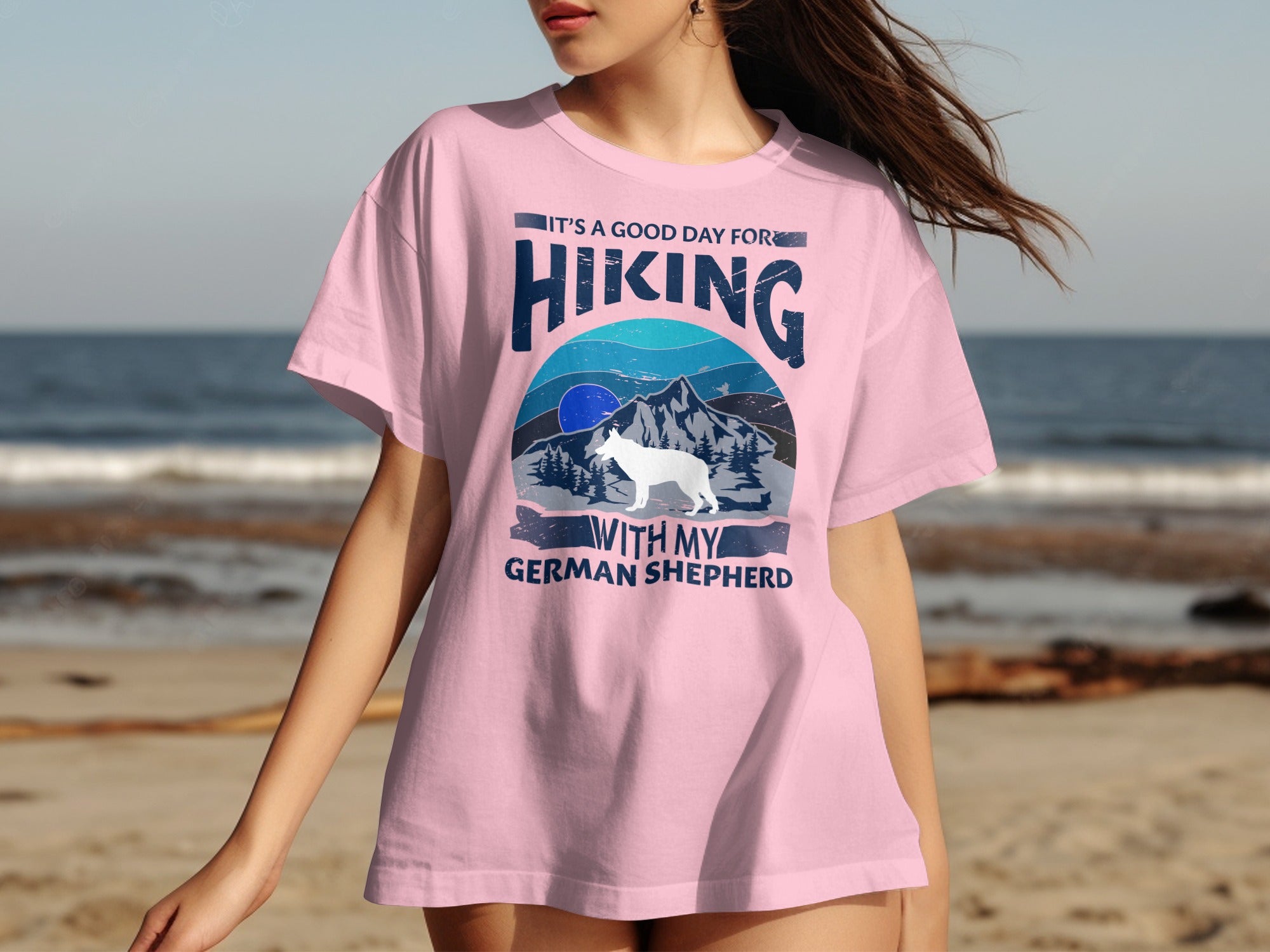 Pink t-shirt with "It's a good day for hiking with my German Shepherd" text and graphic.
