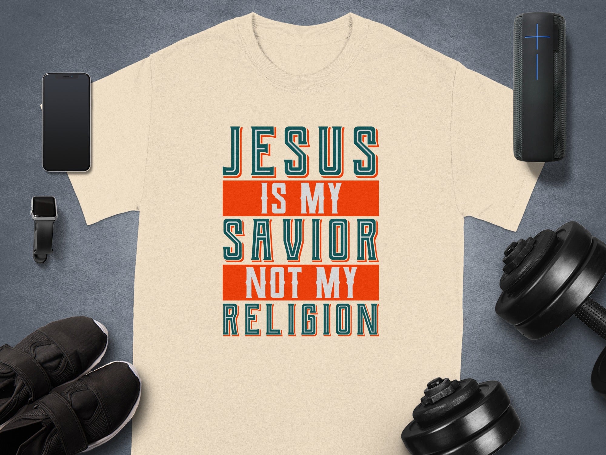 Cream t-shirt with "Jesus Is My Savior Not My Religion" text.