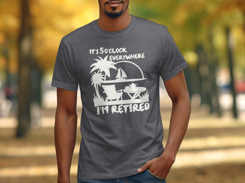 Dark gray t-shirt with white graphic: "It's 5 o'clock everywhere I'm retired."