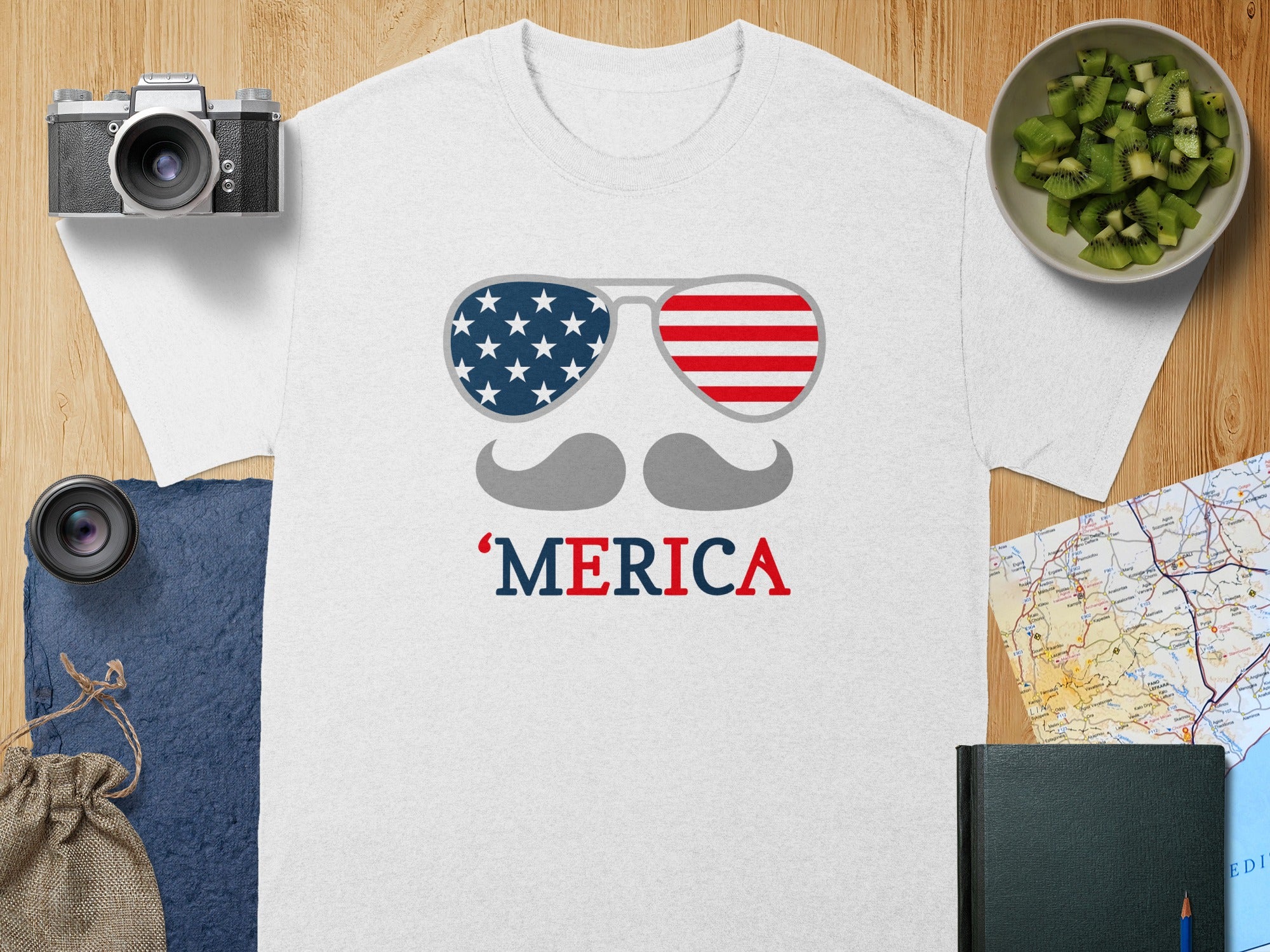 White t-shirt with American flag sunglasses, mustache, and "MERICA" text.