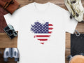 White t-shirt with distressed American flag heart graphic.