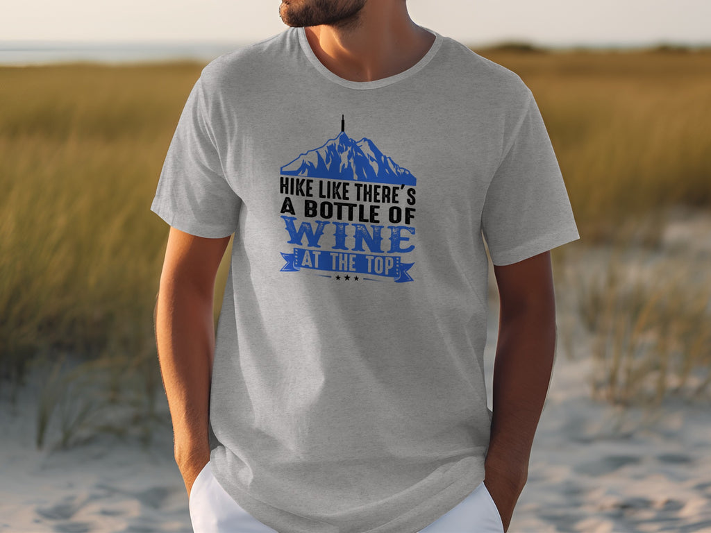 Grey t-shirt with mountains graphic and text "Hike like there's a bottle of wine at the top."