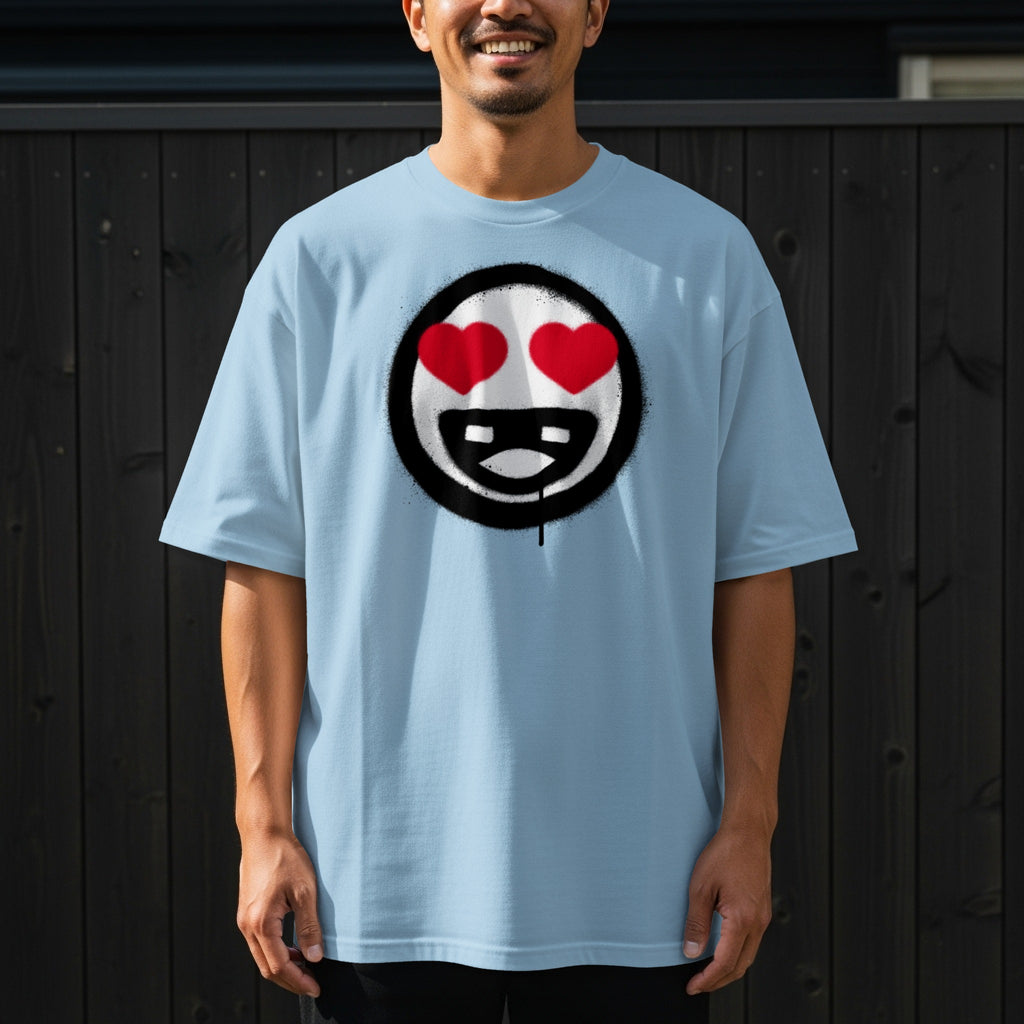 Light blue t-shirt with a black and white smiley face with red hearts and dripping lines.