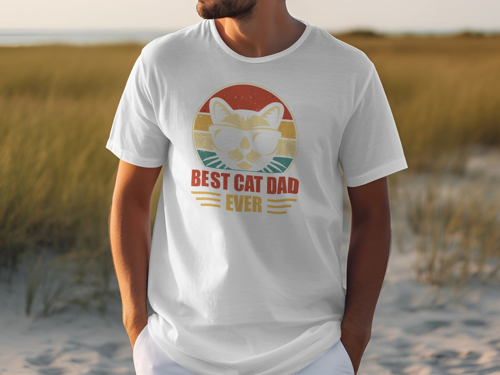 White t-shirt with graphic of a cat in sunglasses and text "BEST CAT DAD EVER".