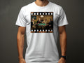 Historical figures play poker on a table, framed by film strip borders, on a white t-shirt.