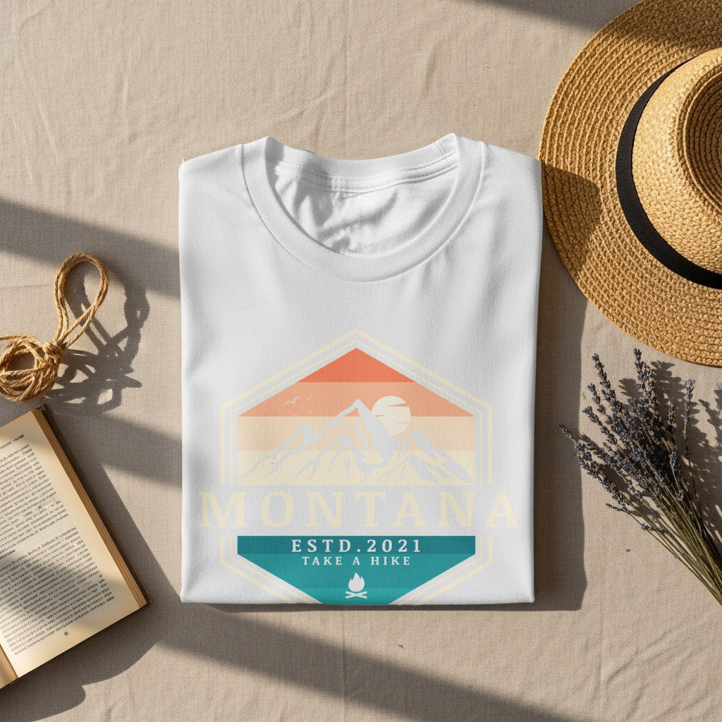 White t-shirt with Montana mountains design, est. 2021, and campfire icon.