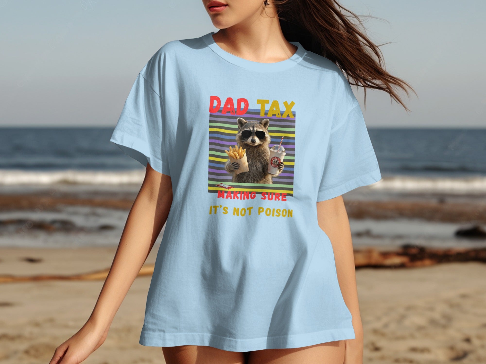 Light blue t-shirt with raccoon wearing sunglasses, holding fries and soda, text "DAD TAX".