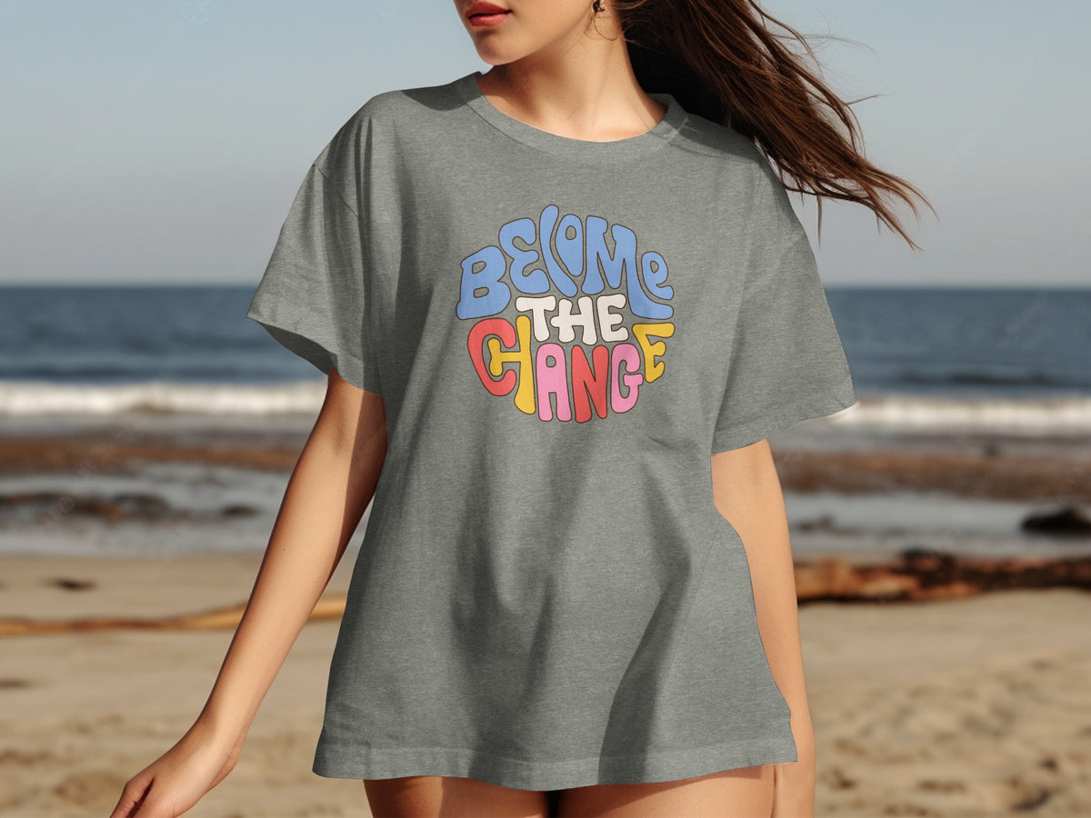 Grey t-shirt with "BECOME THE CHANGE" text in colorful retro font.