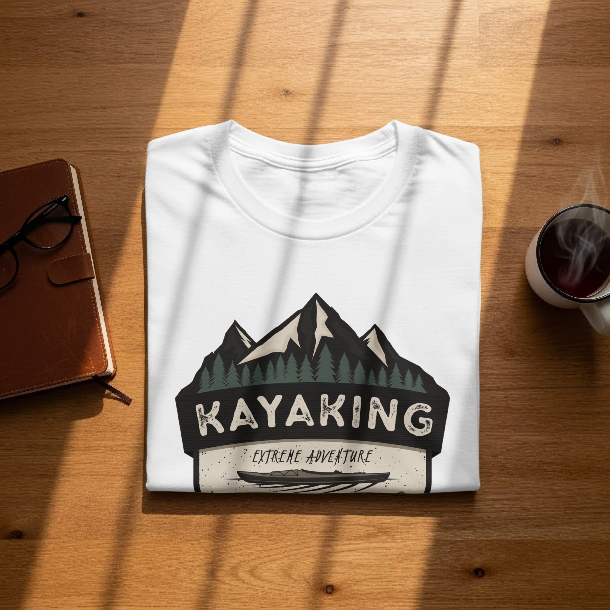 White t-shirt with "Kayaking Extreme Adventure" graphic featuring mountains and a kayak.
