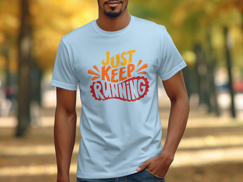 Light blue t-shirt with orange and red "Just Keep Running" graphic.