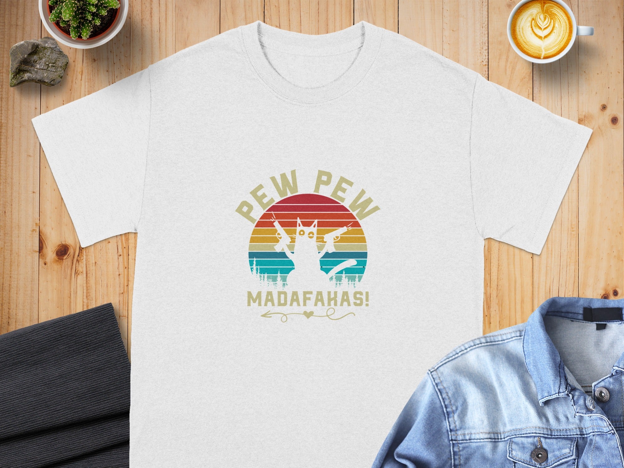 White t-shirt with a cat holding two guns, "Pew Pew" and "Madofakas!" distressed text.