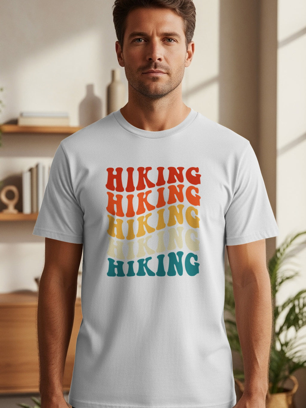 White t-shirt with stacked retro "Hiking" text in red, orange, yellow, and teal.