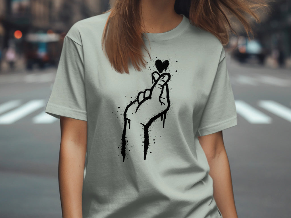 Grey t-shirt with a black spray-paint heart finger gesture design.