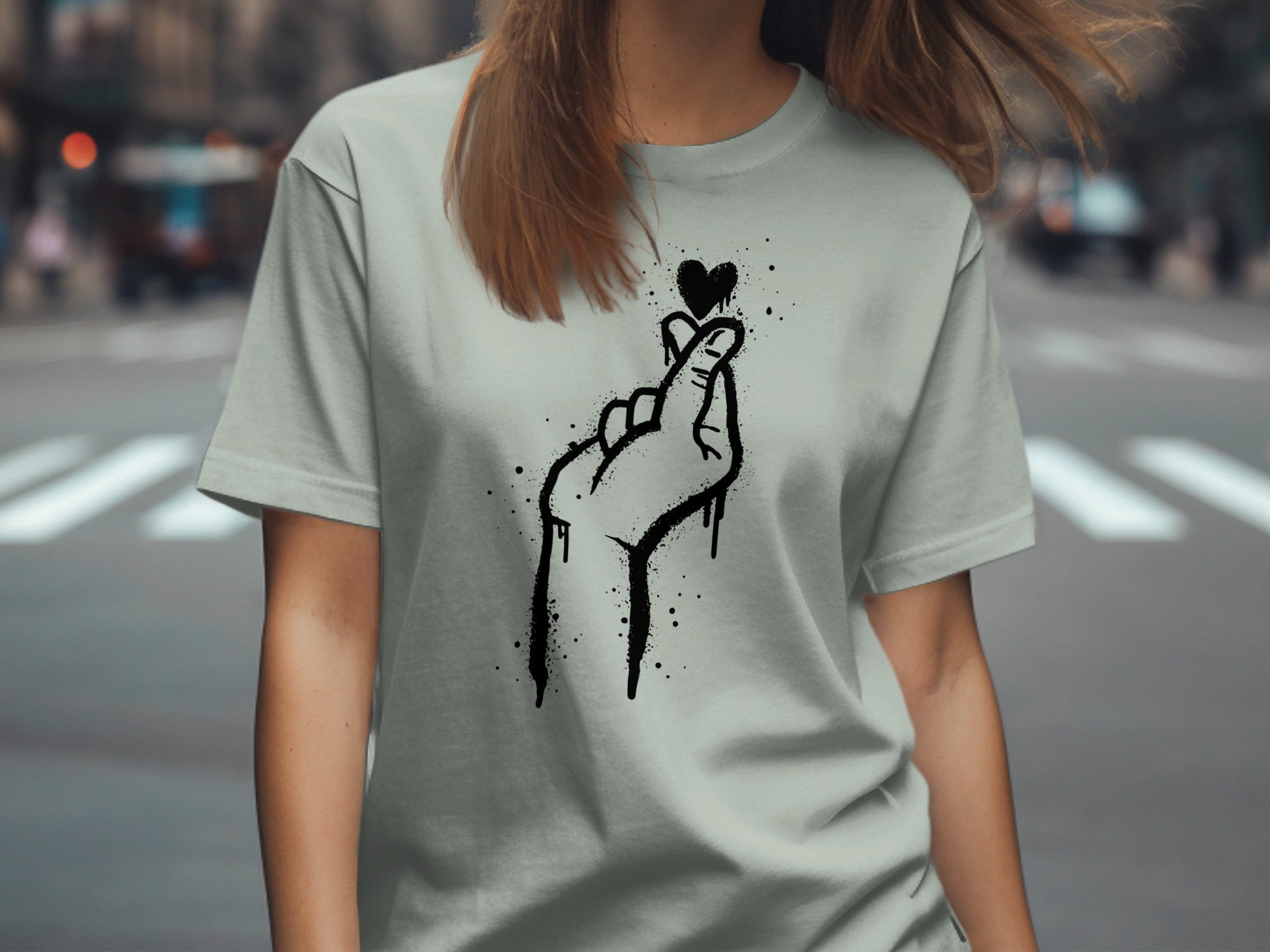 Grey t-shirt with a black spray-paint heart finger gesture design.