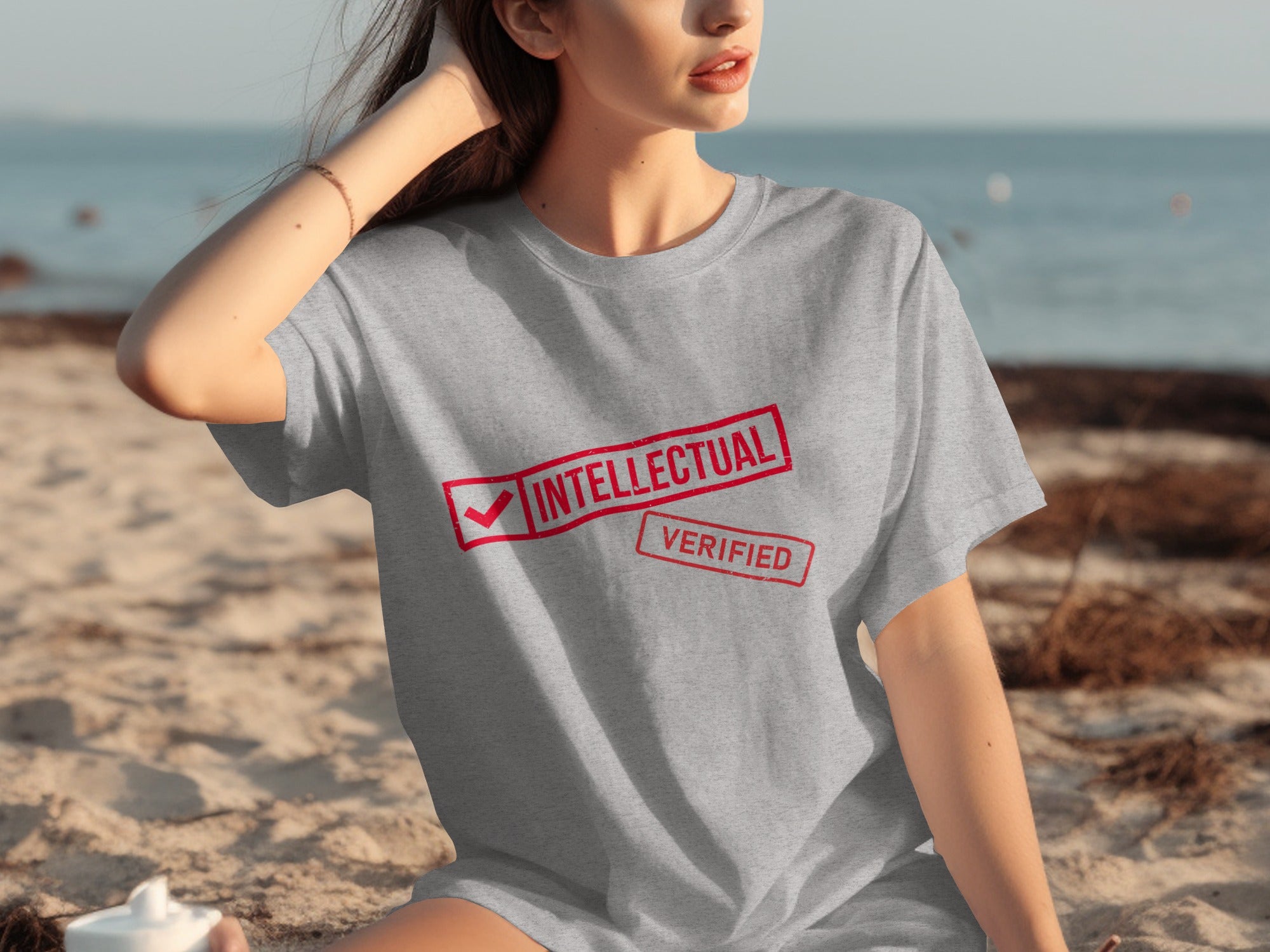 Grey t-shirt with red "INTELLECTUAL VERIFIED" stamp graphic on chest.