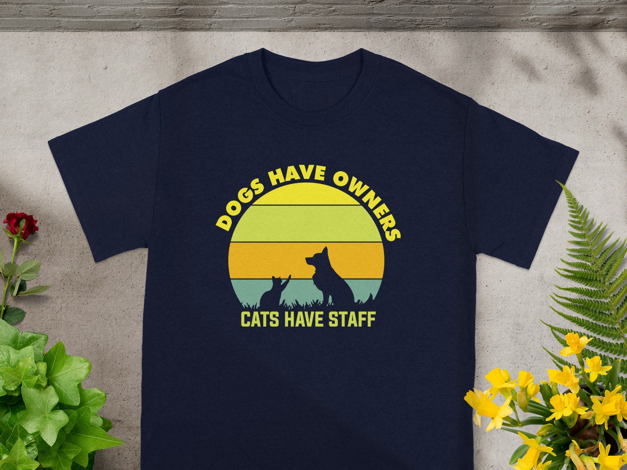 Navy t-shirt with "Dogs Have Owners, Cats Have Staff" text and pet silhouettes.