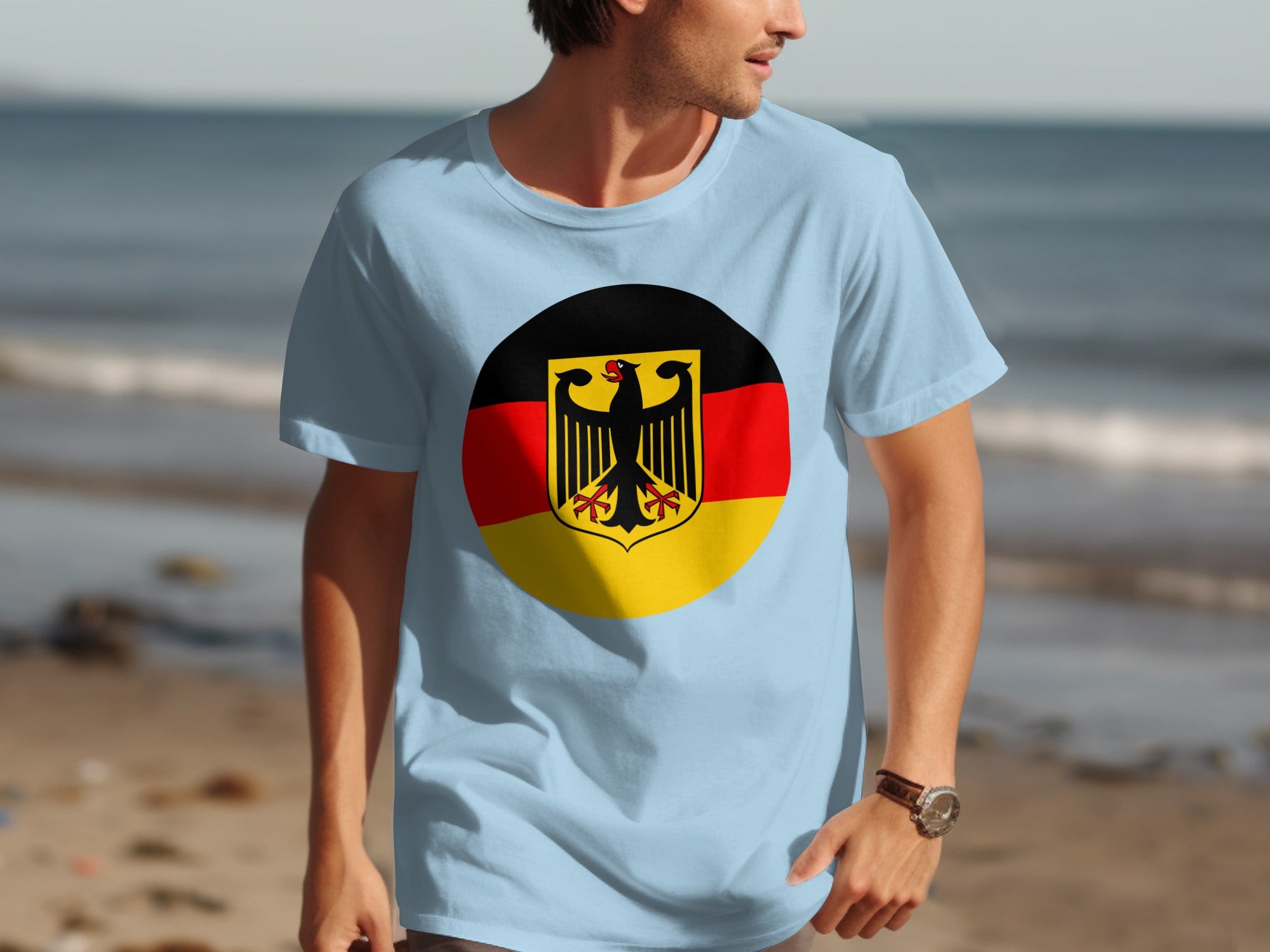 Light blue t-shirt with German flag emblem featuring a black eagle on a yellow shield.