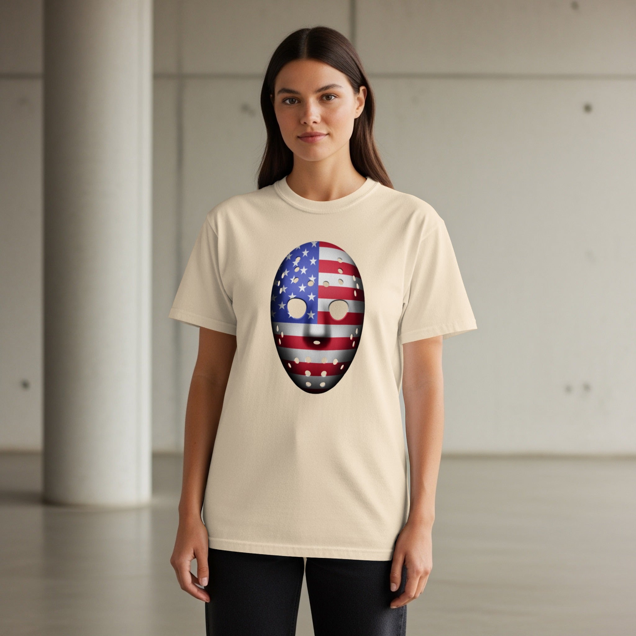 Cream t-shirt with American flag hockey mask graphic on the front.