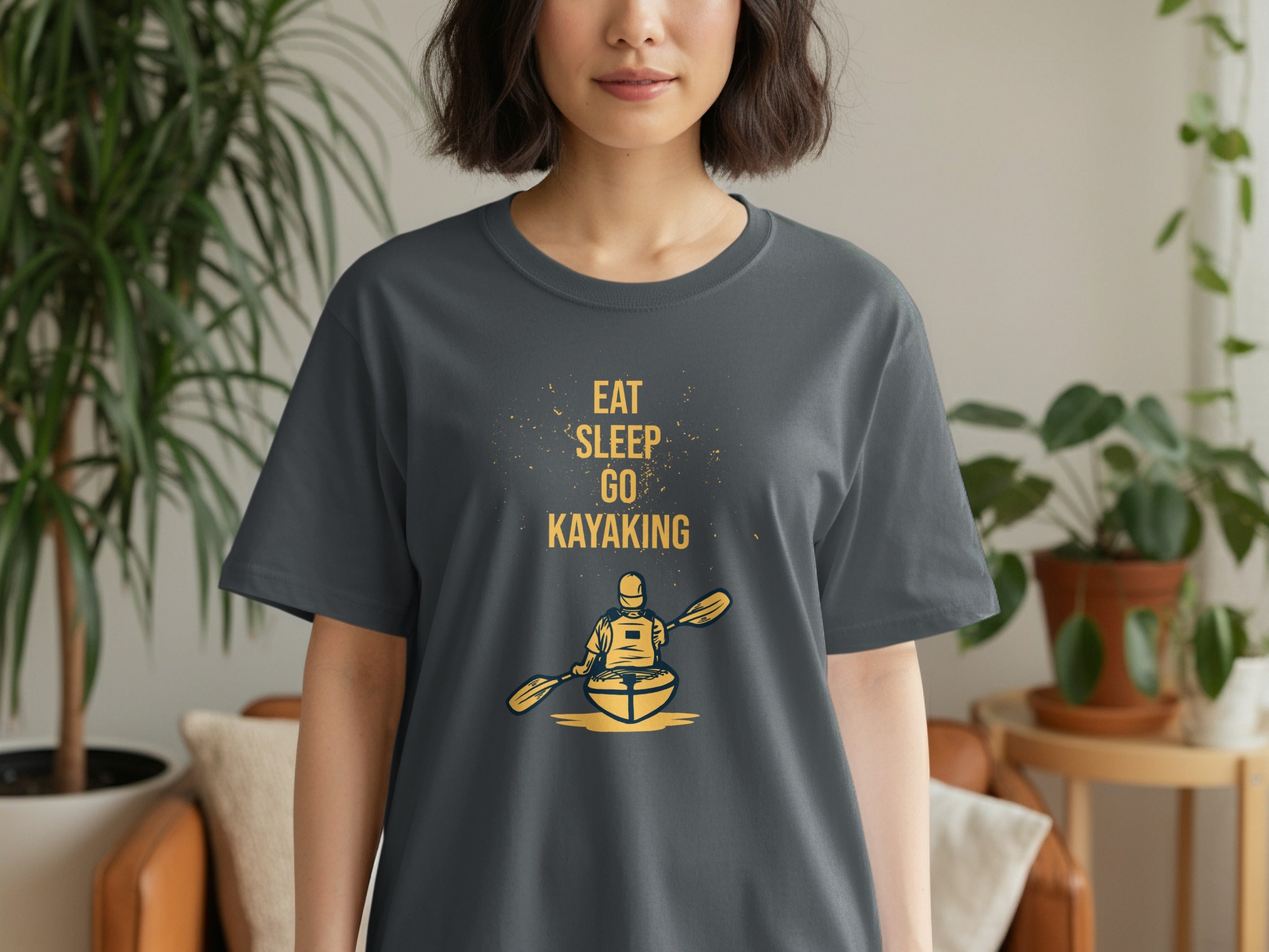 Dark grey t-shirt with yellow text: "Eat Sleep Go Kayaking" and kayak graphic.