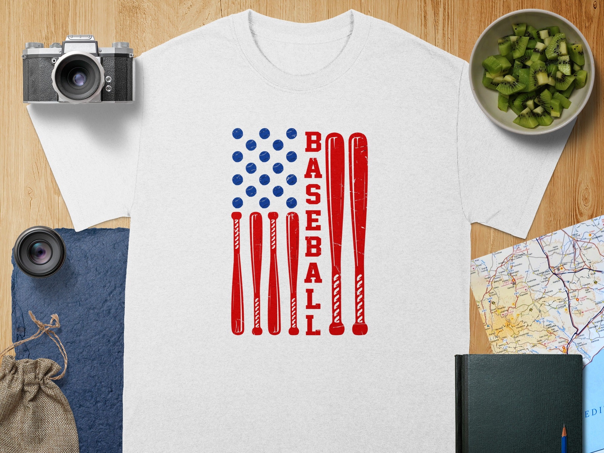 White t-shirt with red baseball bats and blue baseballs arranged as an American flag.