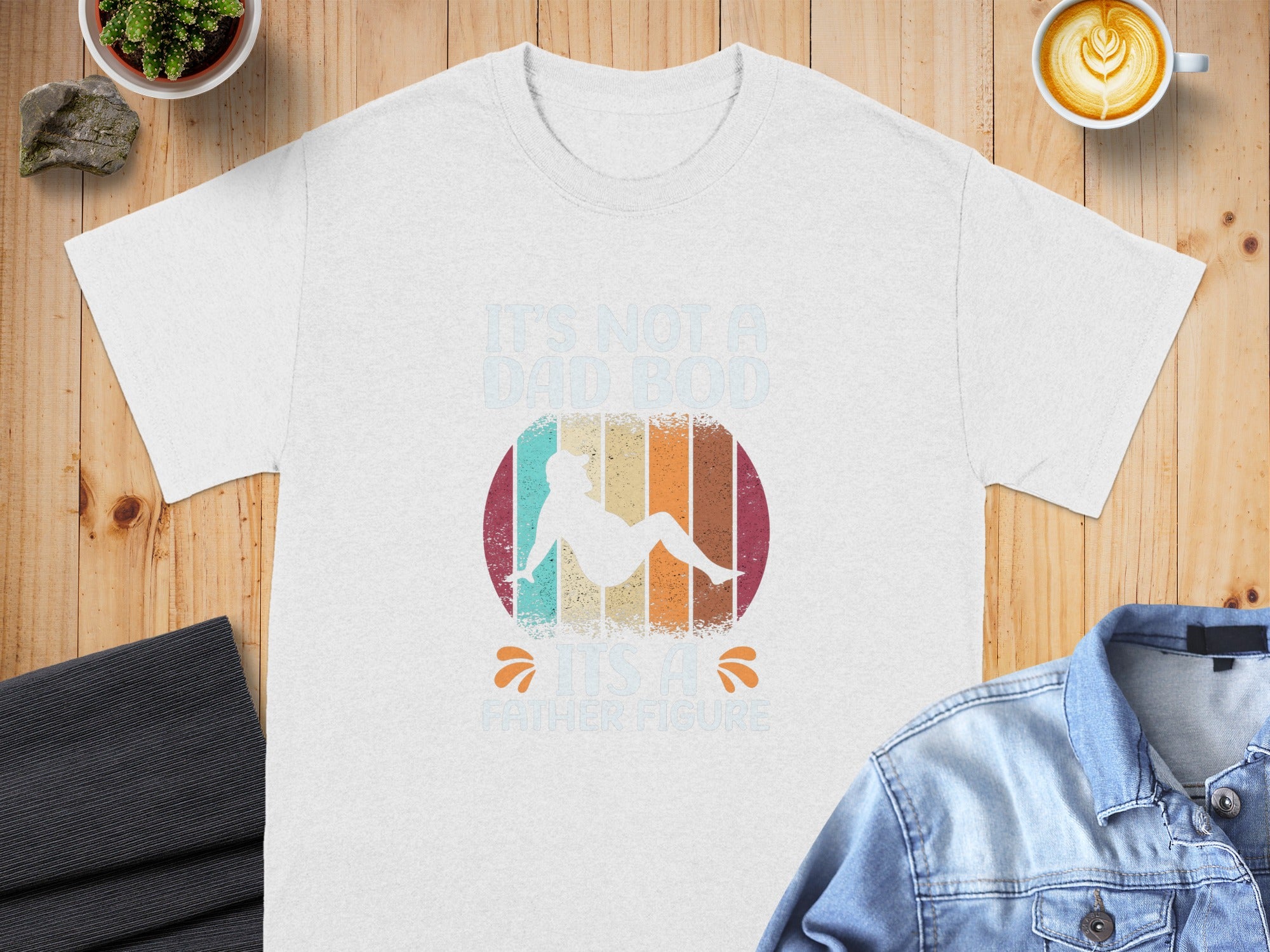White t-shirt with "It's not a dad bod, it's a father figure" text and graphic.