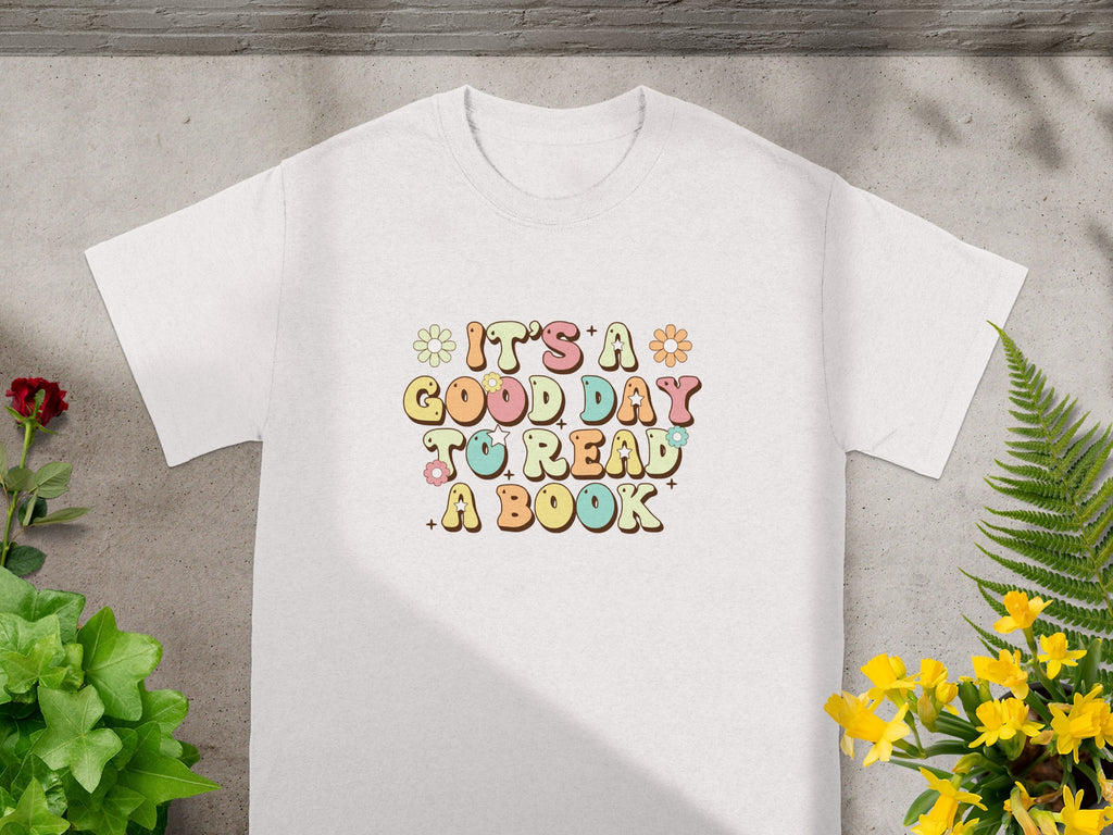White t-shirt with "It's a Good Day to Read A Book" text and floral graphics.