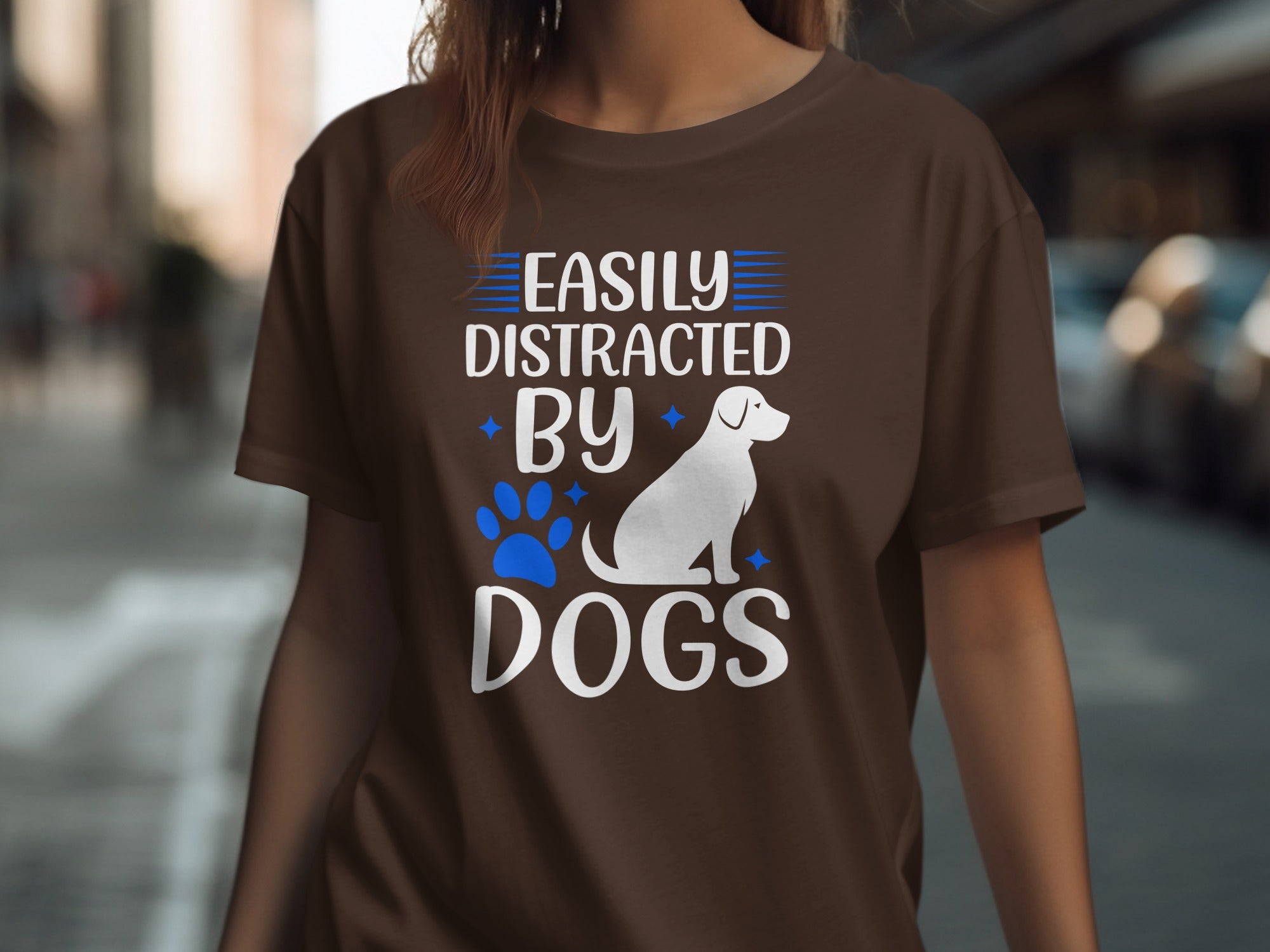 Brown t-shirt with white text and dog graphic: "Easily Distracted By Dogs"