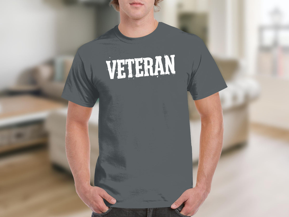 Men's dark grey t-shirt with white distressed "VETERAN" text on front.
