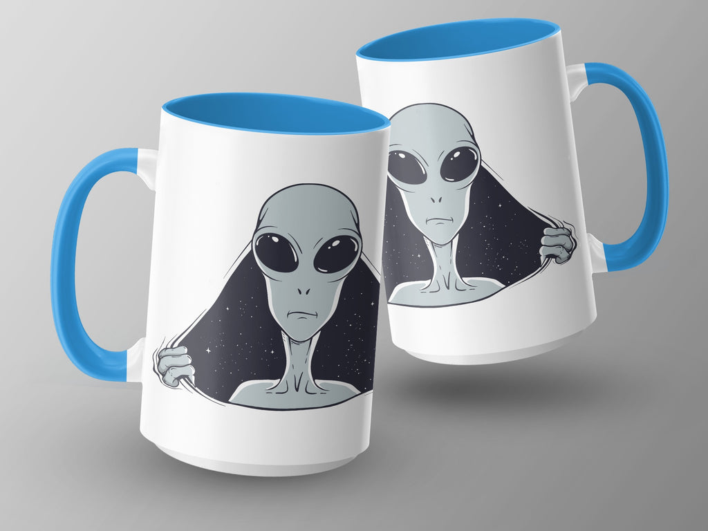Two white mugs with blue handles featuring grey aliens peeking out from a starry background.