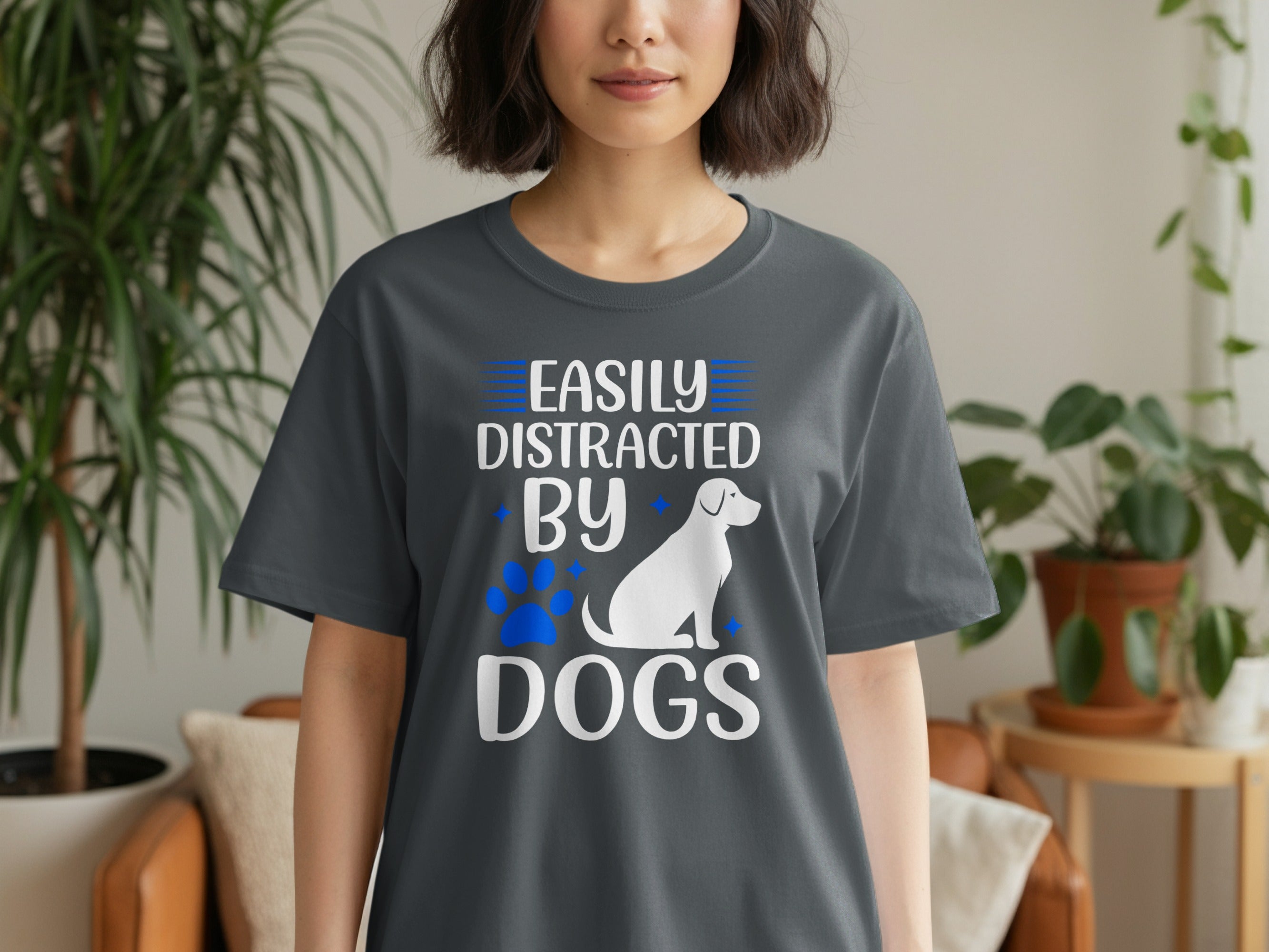 Dark grey t-shirt with white text "Easily Distracted By Dogs" and dog silhouette.