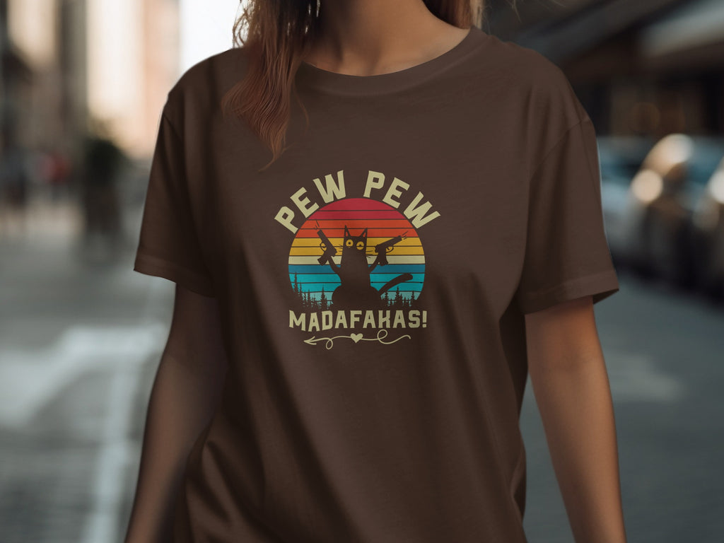 Brown t-shirt with a silhouetted cat holding guns above "PEW PEW MADAFAKAS!".