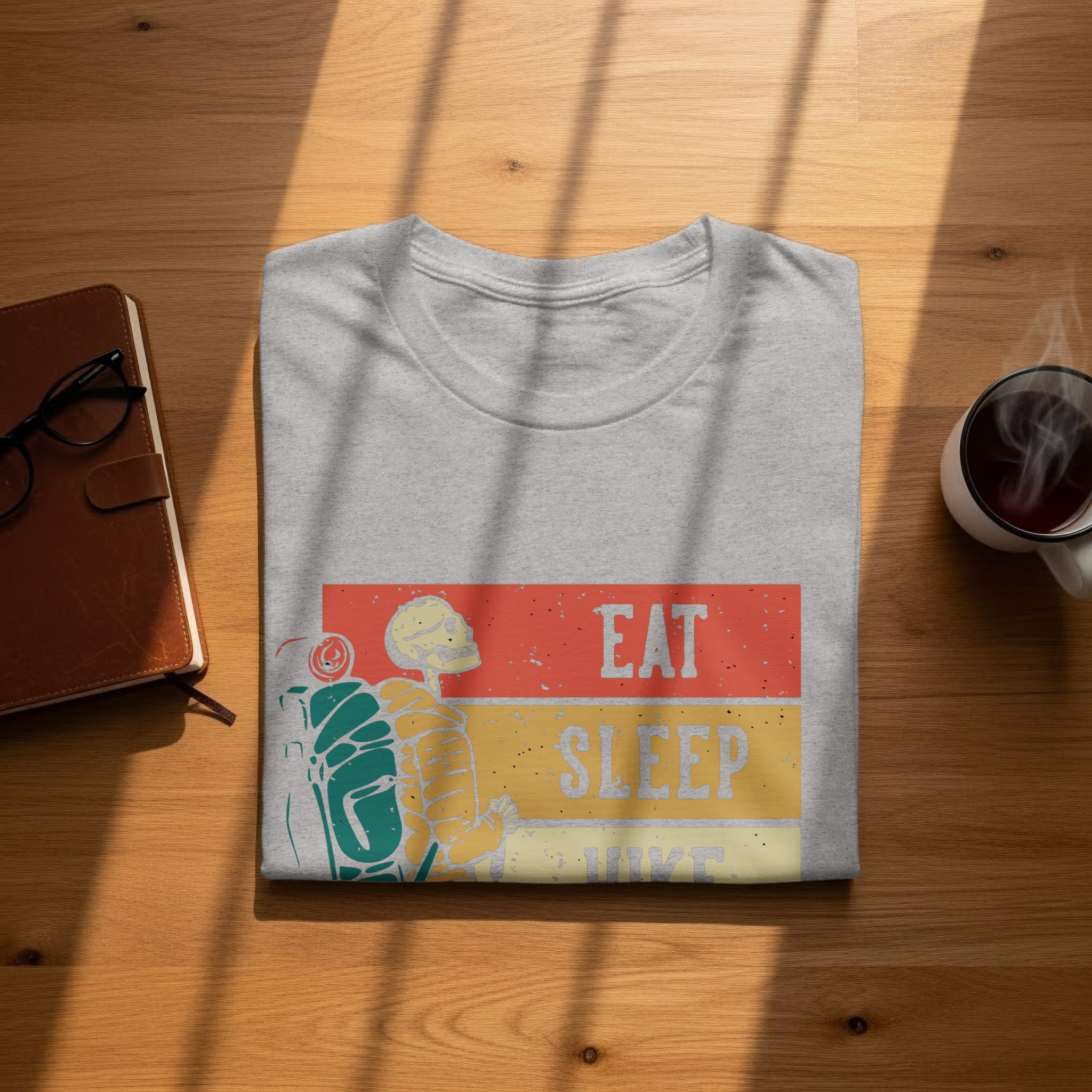 Grey t-shirt with "Eat Sleep Hike" text and a skeleton hiker graphic.