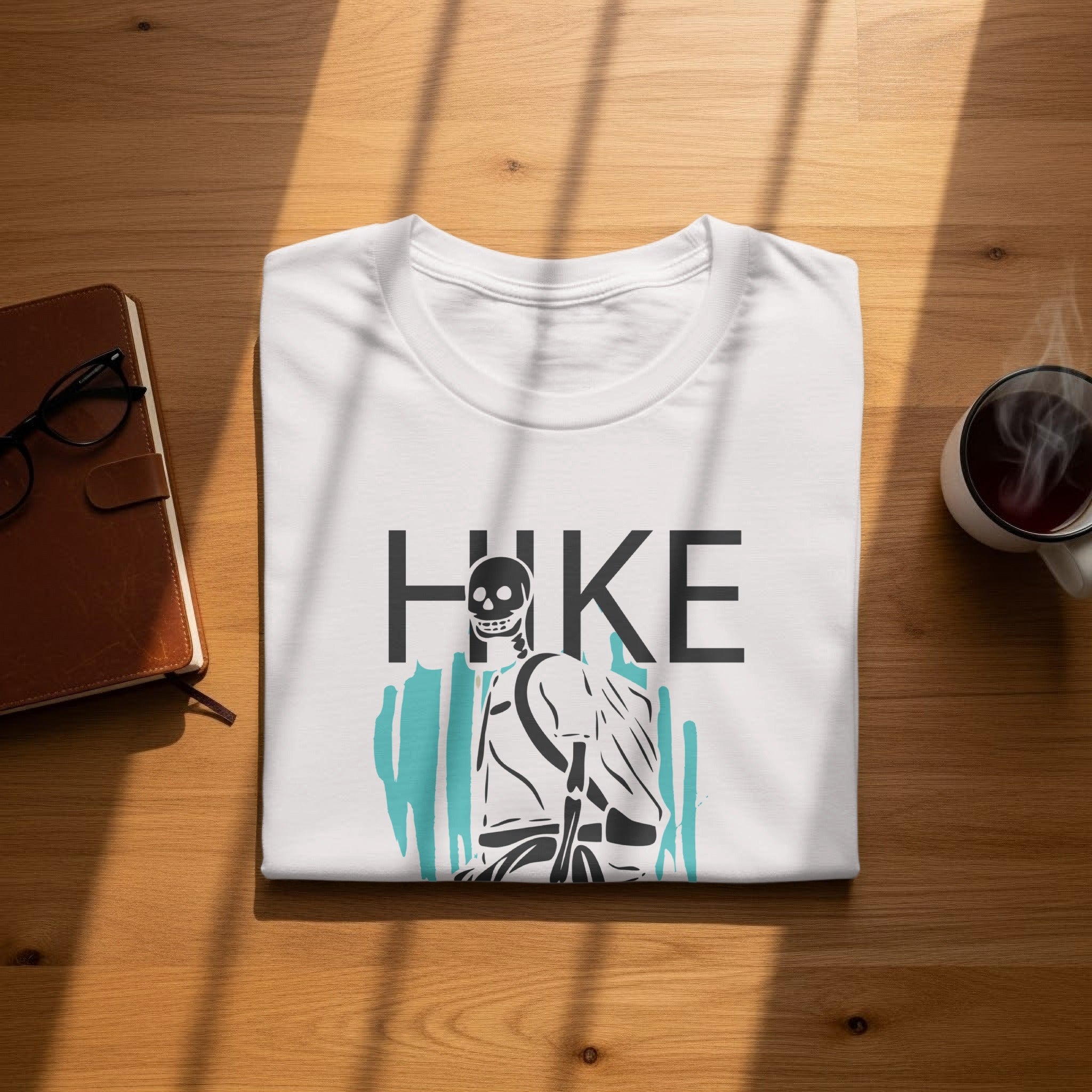 White t-shirt with black "HIKE" text and skeleton hiker graphic.