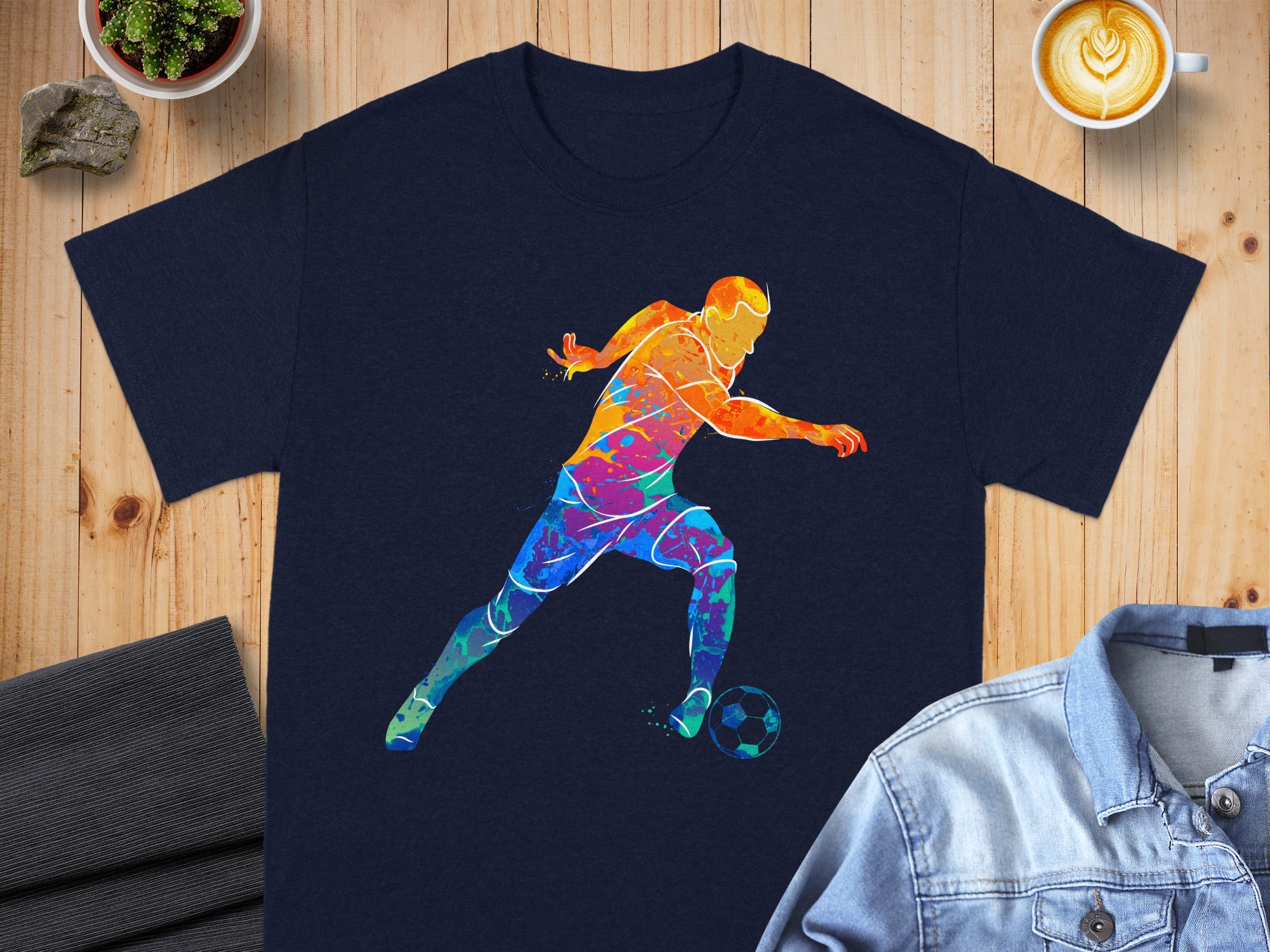 Navy t-shirt with a colorful watercolor soccer player graphic.