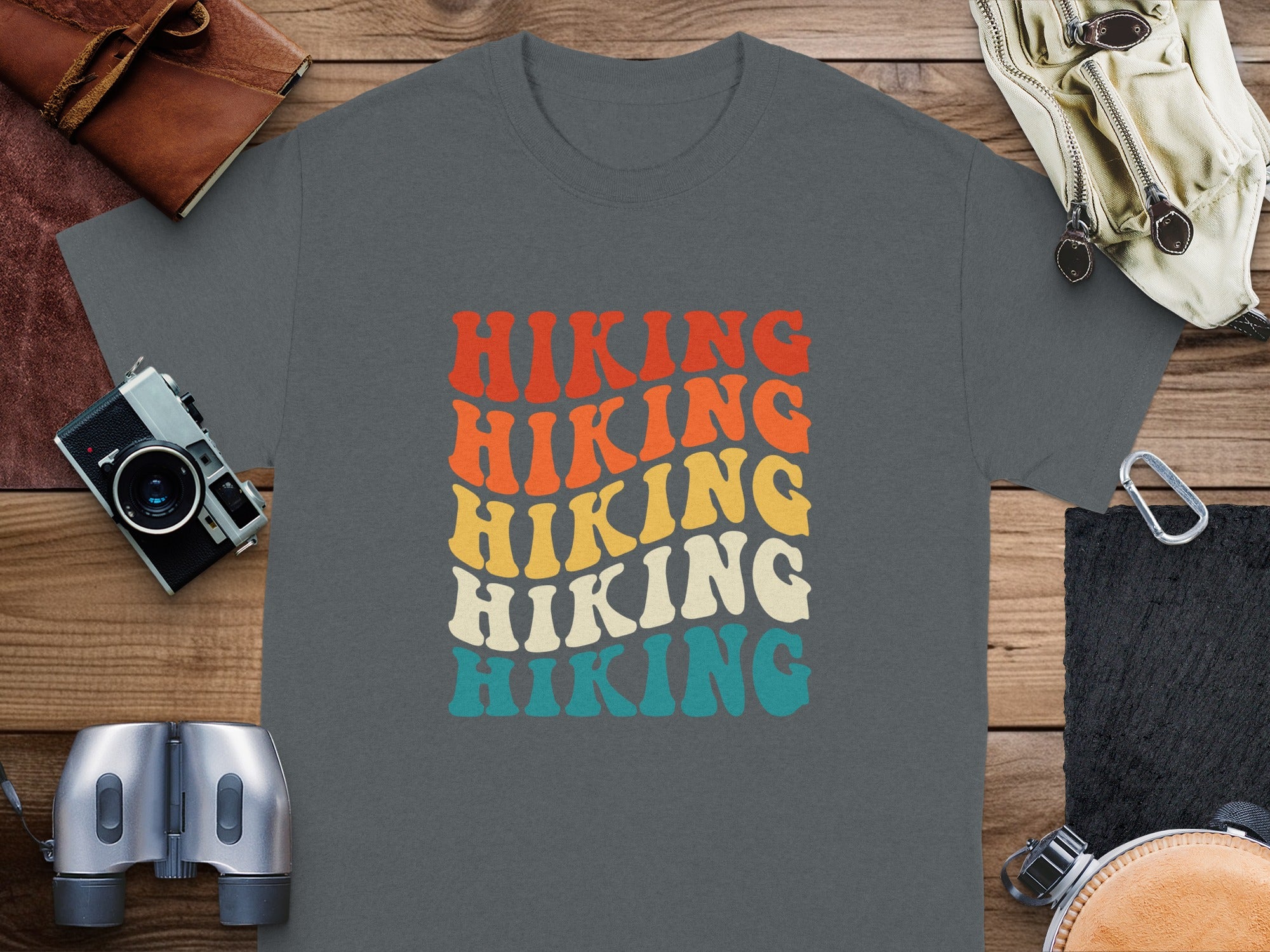 Gray t-shirt with retro "Hiking" text in red, orange, yellow, and teal.