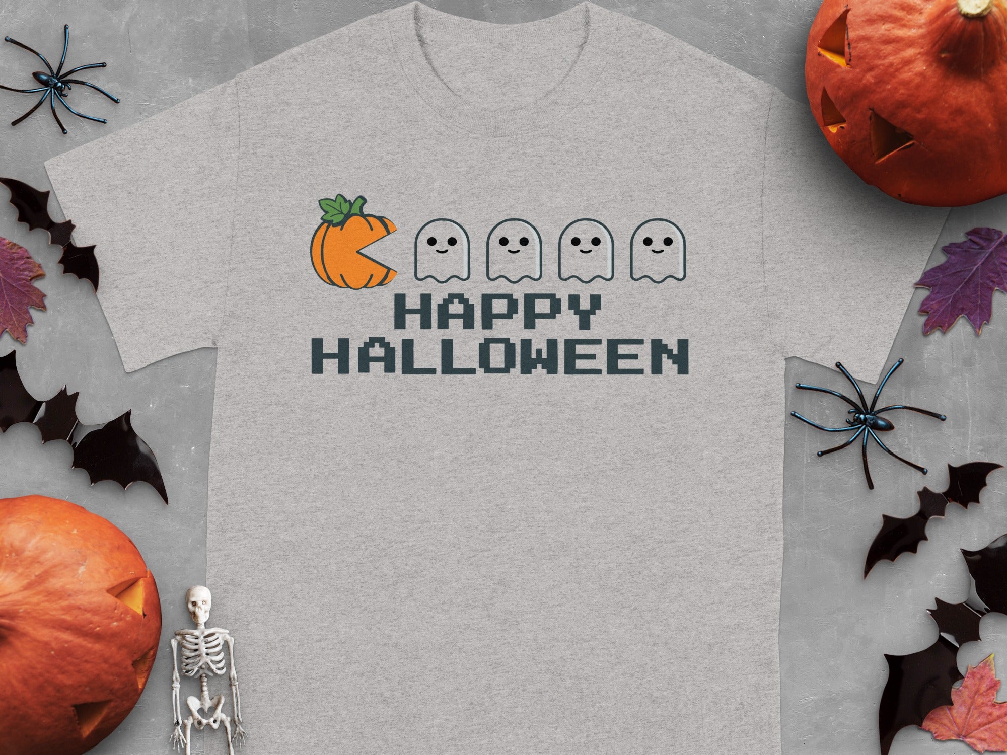 Gray t-shirt with pixelated pumpkin, ghosts, and "Happy Halloween" text.