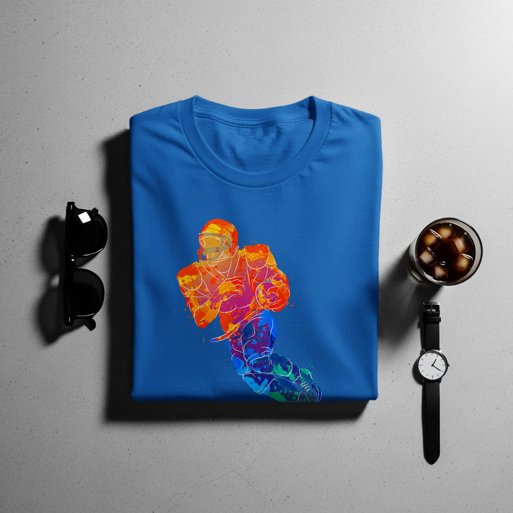 Blue t-shirt with a colorful watercolor football player graphic.