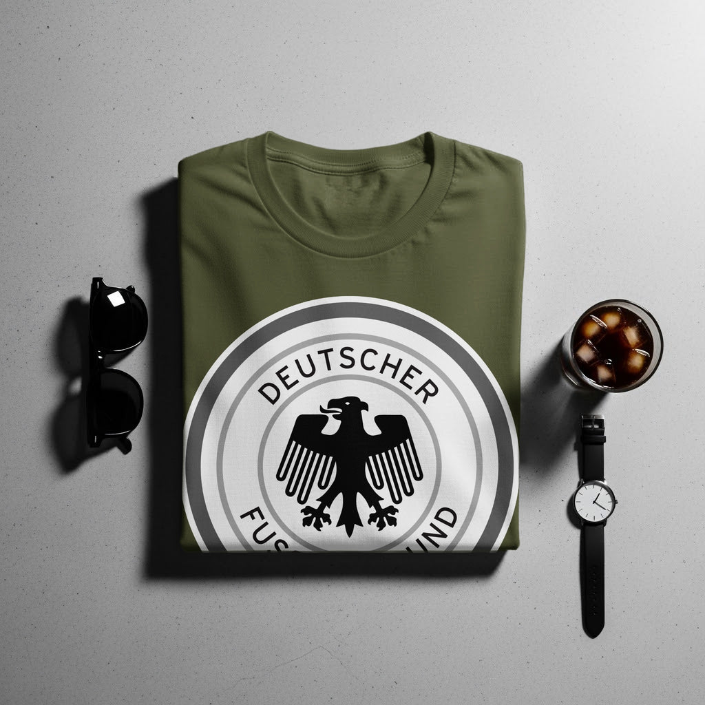 Olive green t-shirt with "Deutscher Fussballbund" crest and black eagle emblem.