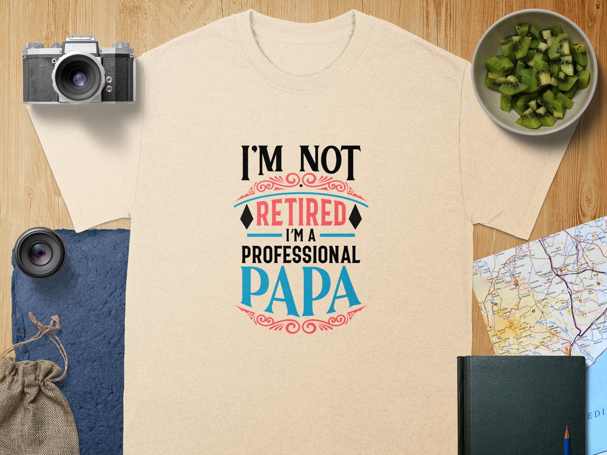 Beige t-shirt with "I'M NOT RETIRED I'M A PROFESSIONAL PAPA" graphic.