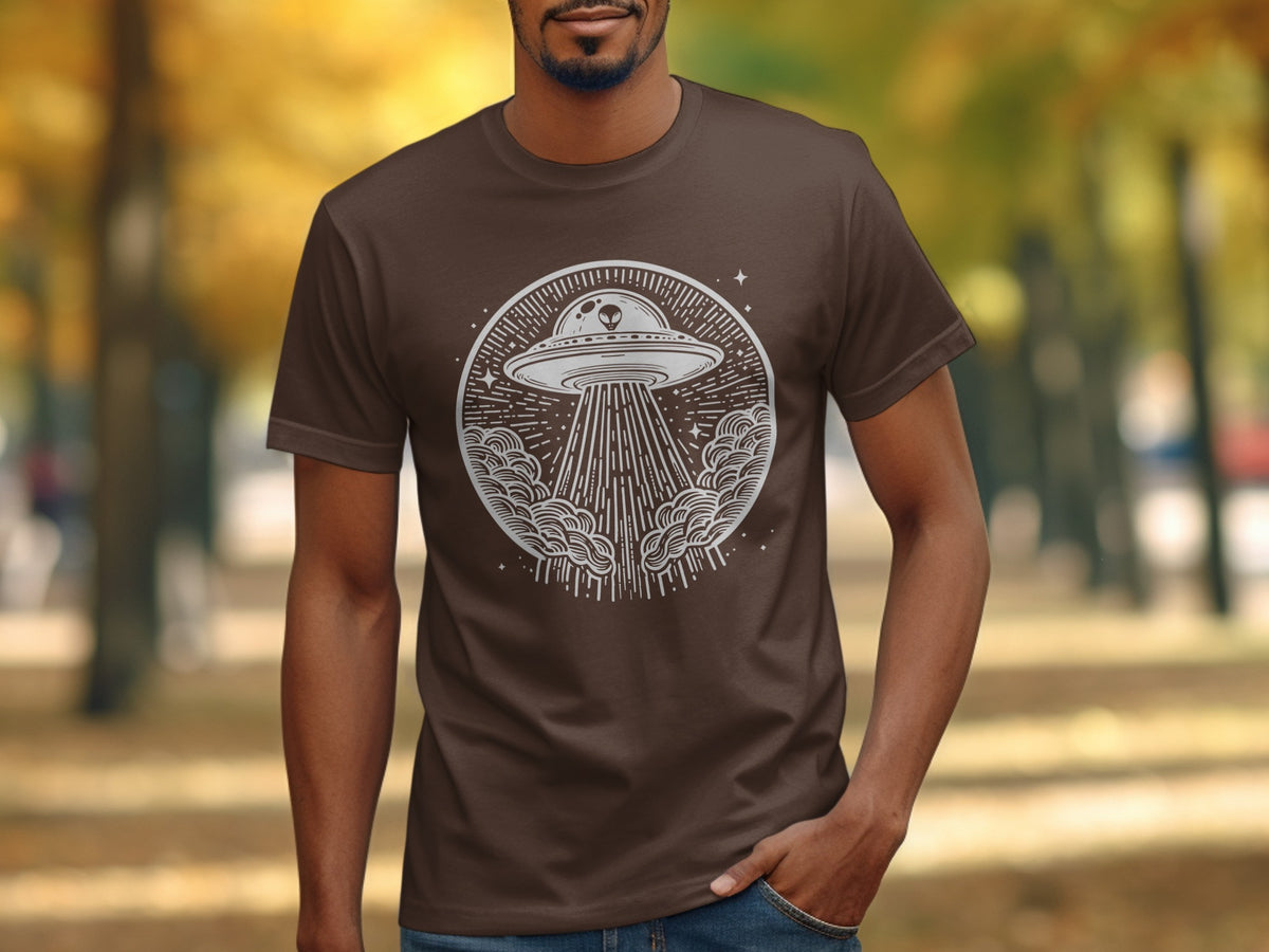 Brown t-shirt with white alien spaceship and beam design on front.