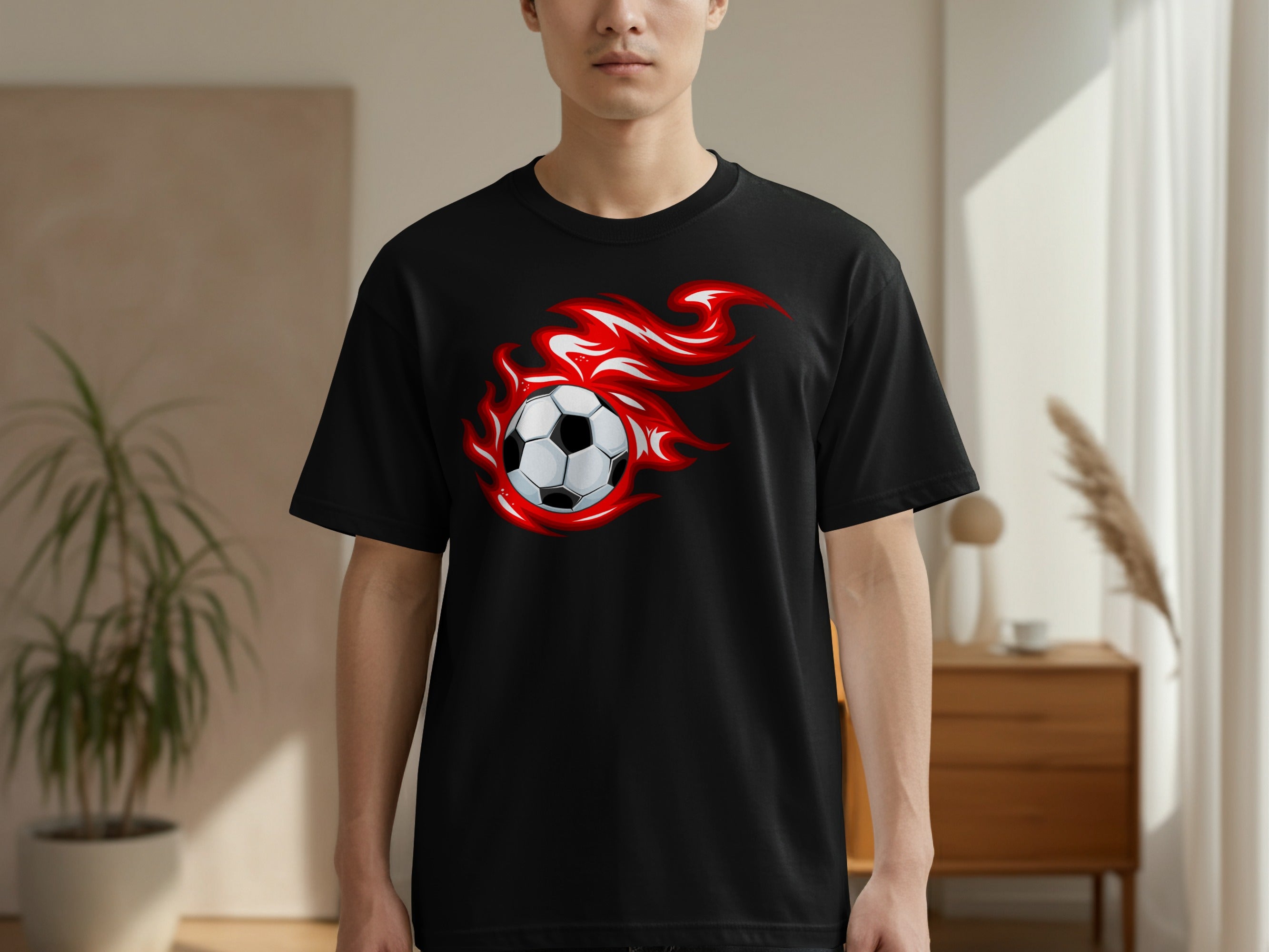 Black t-shirt with animated fiery soccer ball graphic on the front.