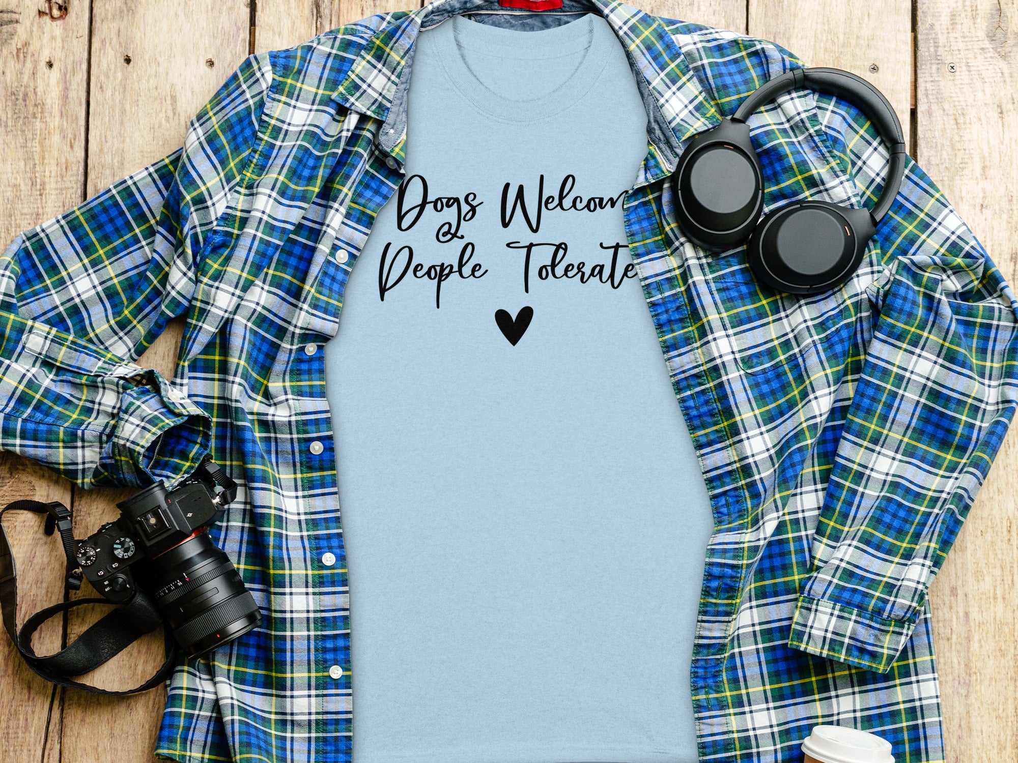 Light blue t-shirt with "Dogs Welcome People Tolerate" text and a heart.